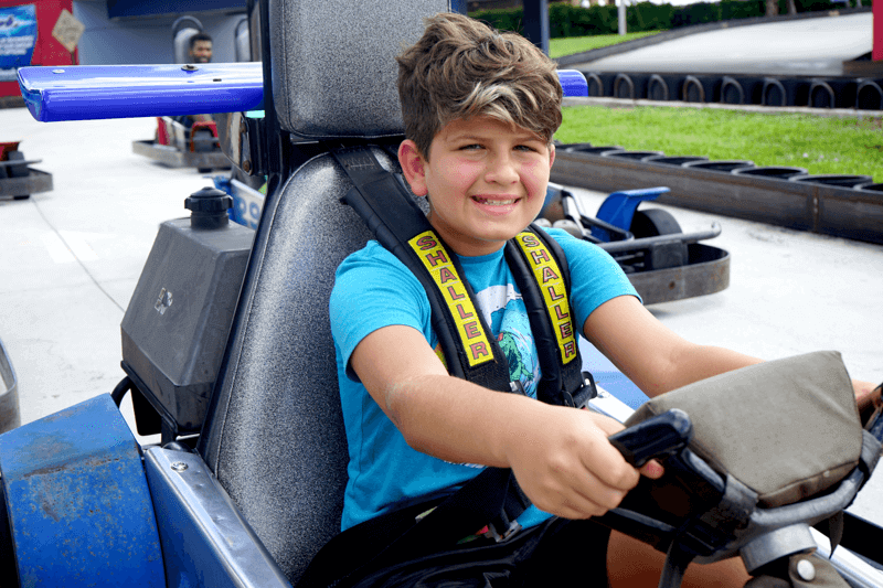 Boy drives rookie go kart at Boca Raton