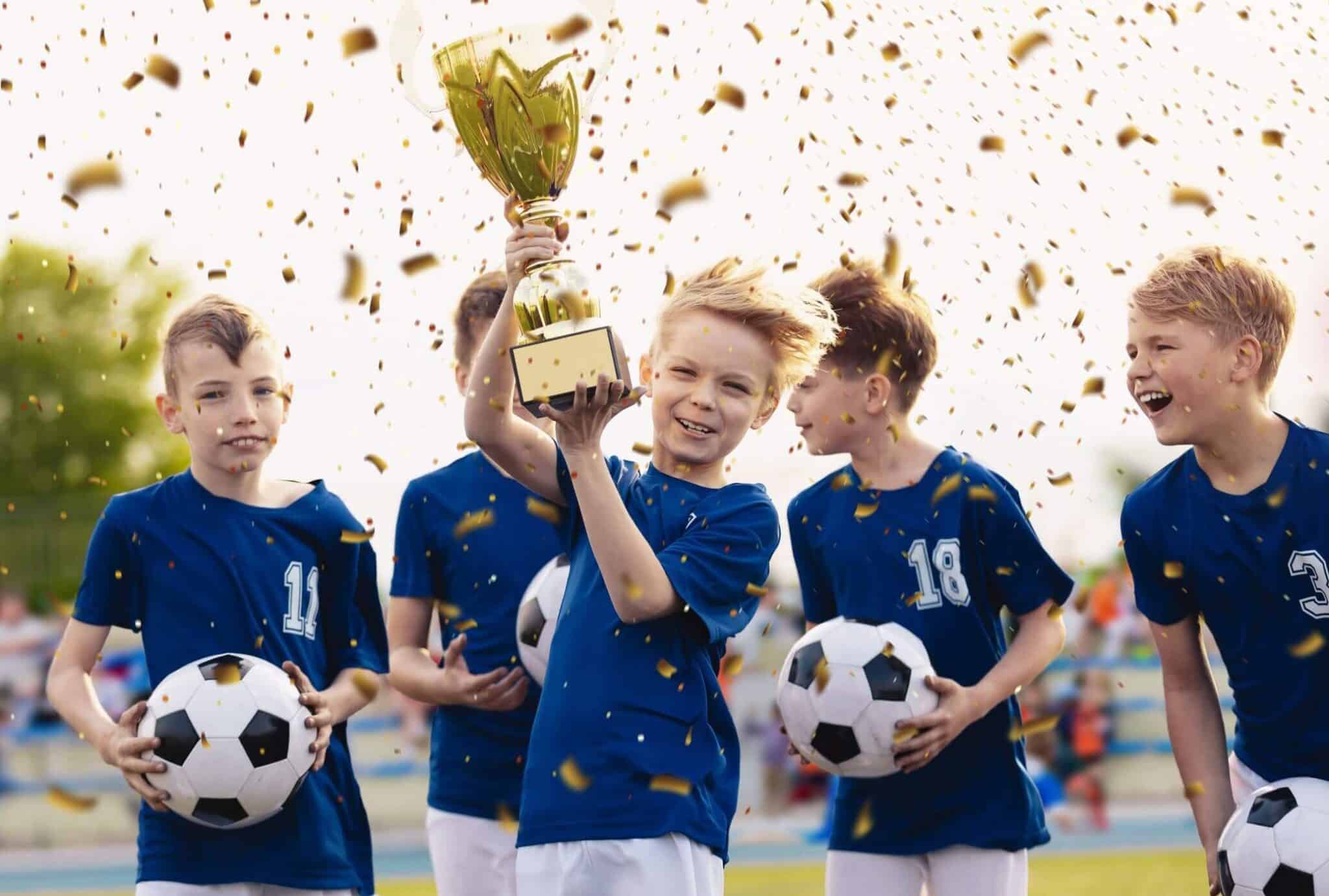 Sports Team Celebrating with a Trophy